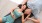 a couple lying down in a yoga studio