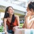 two friends laughing in a shopping center