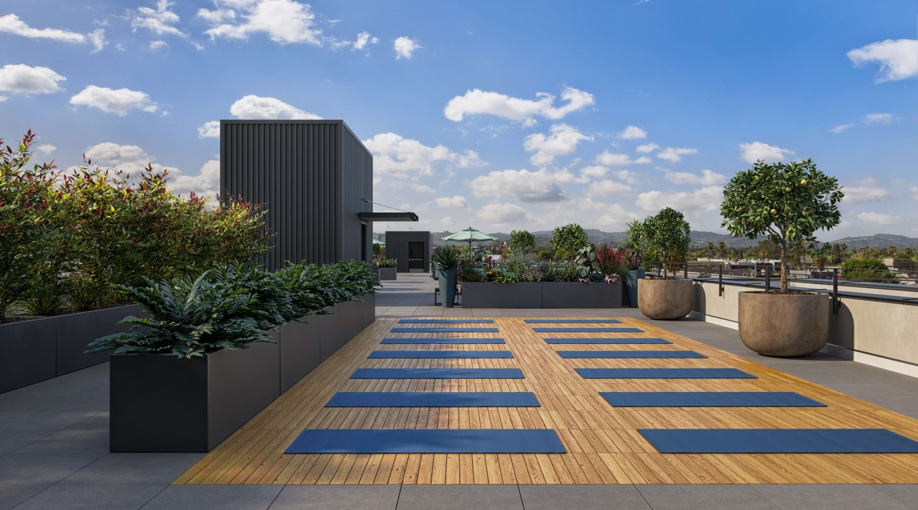Rooftop Yoga Deck | Pendant on Topanga Apartments near Warner Center Rooftop yoga deck with scenic mountain views at Pendant on Topanga apartments near Warner Center.