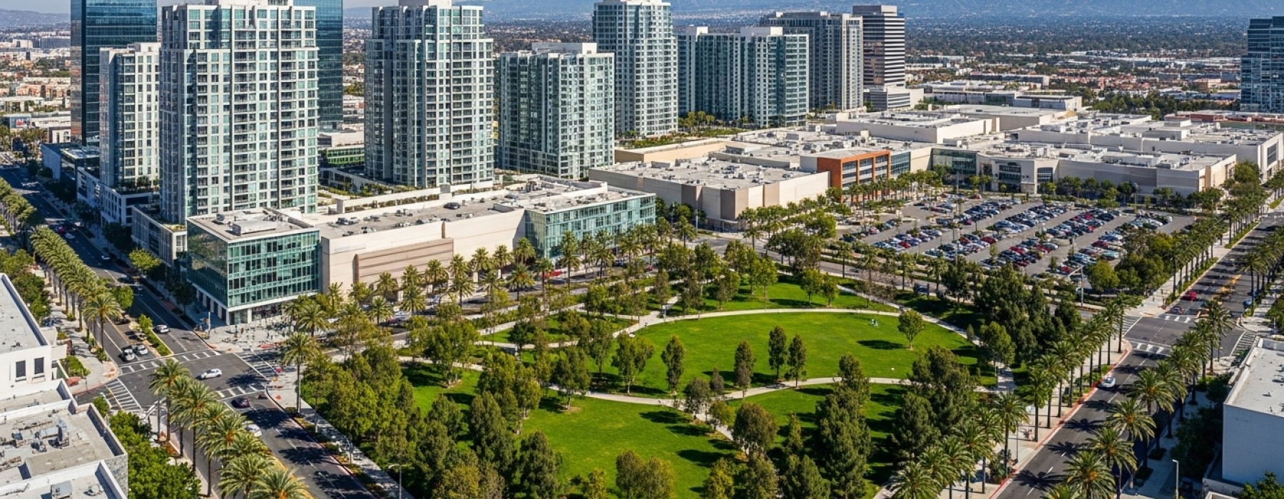 Aerial view of Warner Center in Woodland Hills showing apartments, shopping centers, and parks in the San Fernando Valley.